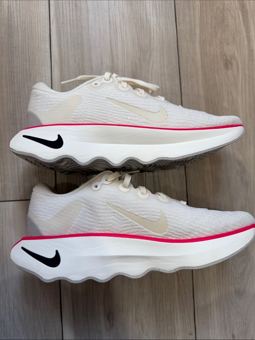 Nike Women’s Sneaker — Cream Knit with Pink Midsole Trim